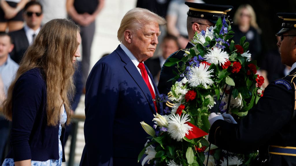 Donald Trump hangs a wreath at Arlington National Cemetery.