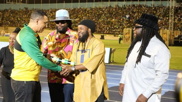 Peter Anthony Morgan is honored in front of a packed stadium in Jamaica.