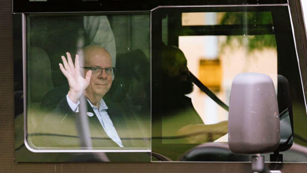 Former Governor Larry Hogan waves from his campaign bus after voting. 
