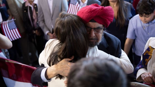 Nikki Haley embraces her father Ajit Singh Randhawa during a campaign event to launch her presidential bid, at the Charleston Visitor Center in Charleston, South Carolina, on Feb. 15, 2023.