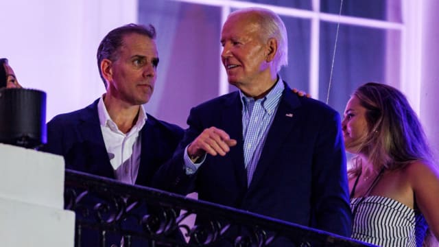 President Joe Biden talks to his son, Hunter Biden, following the fireworks on the National Mall earlier this month.