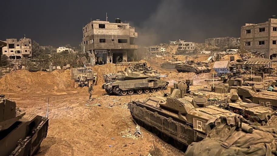 Israeli tanks roll into a war-torn Gaza City.