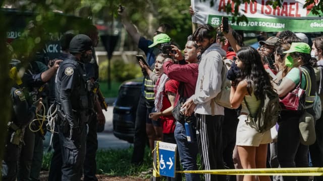 Protesters confront police at Emory University in Atlanta.