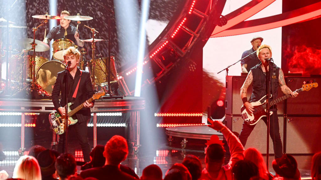 Tré Cool, Billie Joe Armstrong and Mike Dirnt of Green Day perform during Dick Clark's New Year's Rockin' Eve
