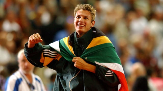 South Africa's Jacques Freitag celebrates winning the gold medal in the High Jump at the 2003 IAAF World Athletics Championship in Paris.