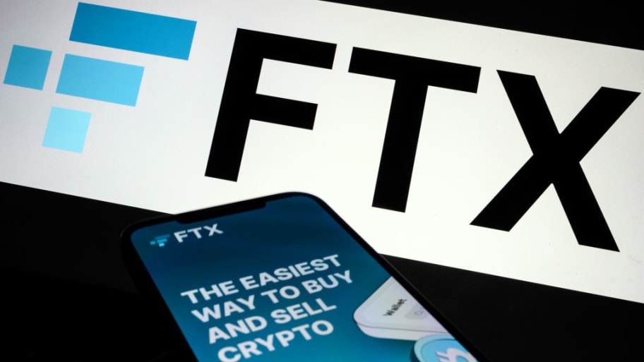 In this photo illustration the FTX logo and mobile app adverts are displayed on screens on November 10, 2022 in London, England.