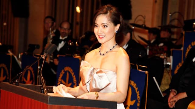 Angela Chao, wearing a dress, speaks at a 2010 event.