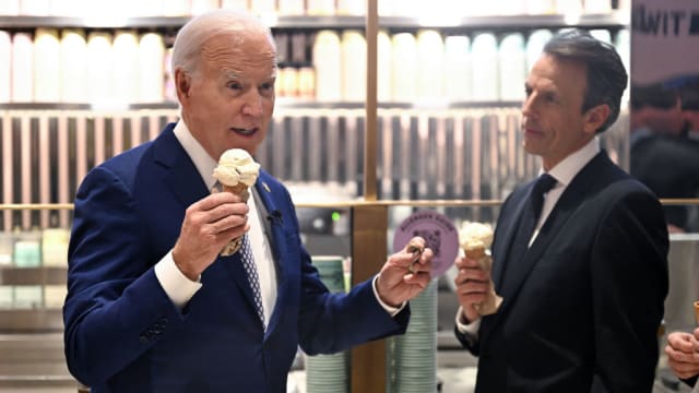 U.S. President Joe Biden speaks with host Seth Meyers as they enjoy an ice cream at Van Leeuwen Ice Cream after taping an episode of “Late Night with Seth Meyers” in New York City.