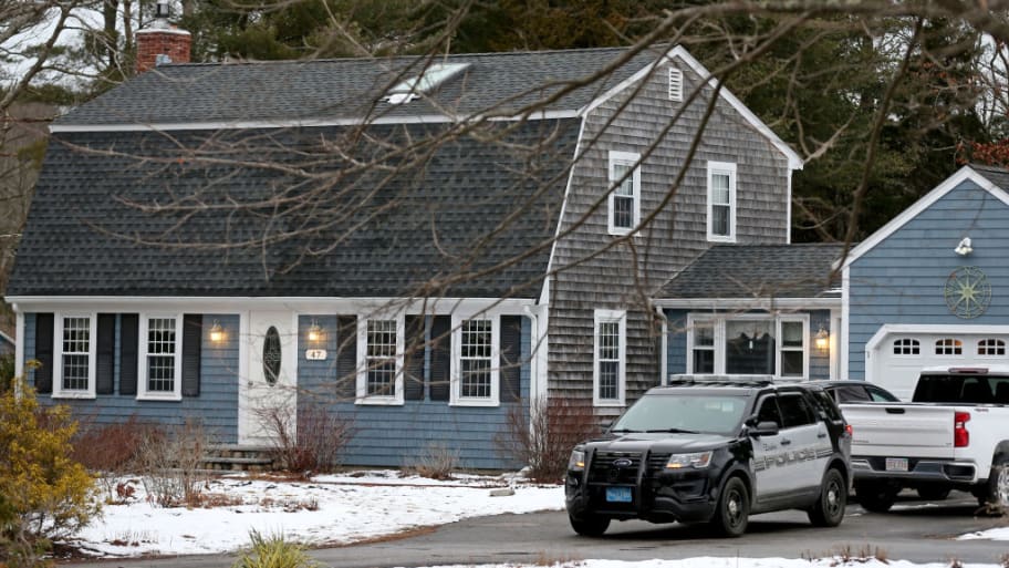 A police cruiser sits in the driveway at 47 Summer Street, the home of Lindsay Clancy, 32, who strangled her three children and then attempted suicide, January 25, 2023 in Duxbury, Massachusetts. 