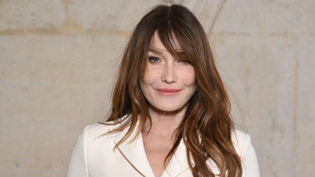 Carla Bruni is reportedly a suspect in her husband Nicolas Sarkozy’s witness-tampering case.