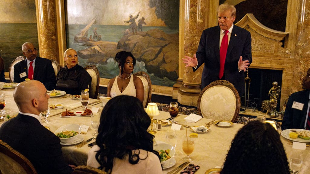 Former U.S. President Donald Trump speaks at a dinner at Mar-a-Lago.