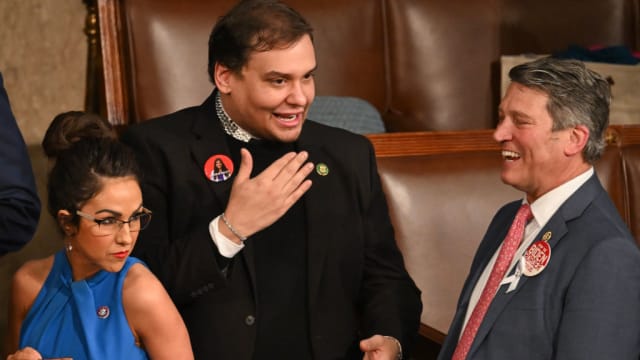 Former U.S. Representative George Santos speaks with Ronny Jackson at the 2024 State of the Union.