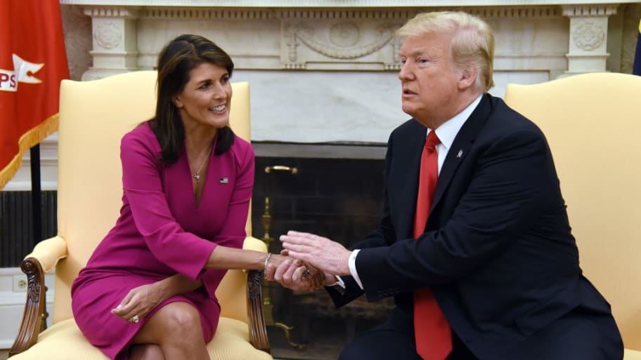 Former President Donald Trump shakes hands with Former United Nations Ambassador Nikki Haley in the Oval office of the White House in Washington, DC.
