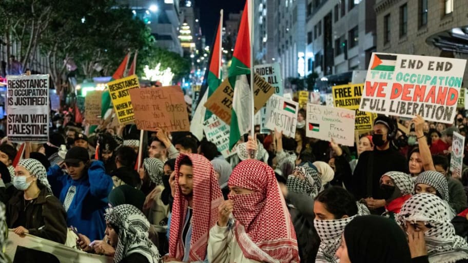 Protesters marching in support of Palestinians fill an intersection near where the US President was holding a fundraiser while in town for the Asia-Pacific Economic Cooperation (APEC) summit in San Francisco.