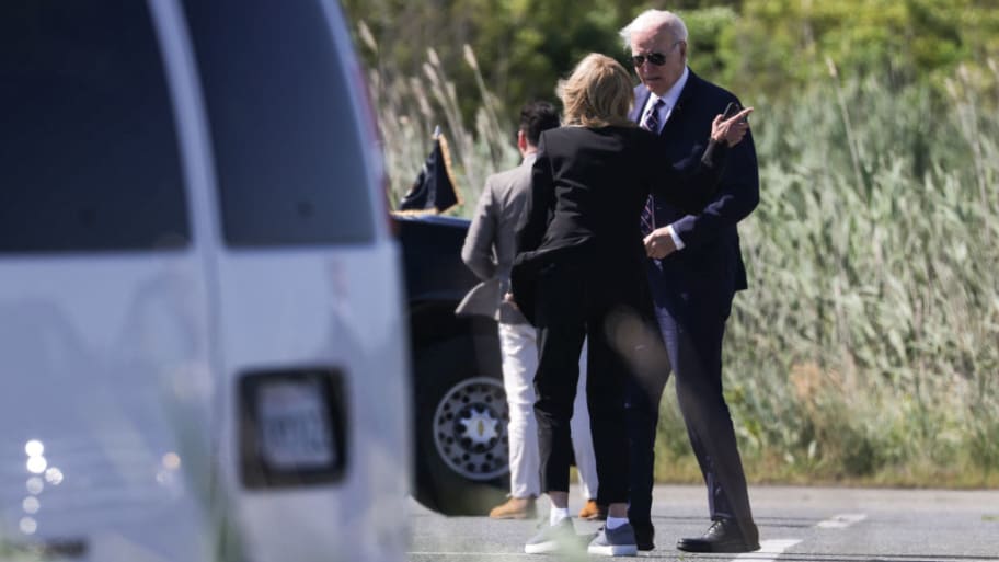 "US President Joe Biden speaks with First Lady Jill Biden after they exiting Marine One in Rehoboth Beach, Delaware Thursday. 