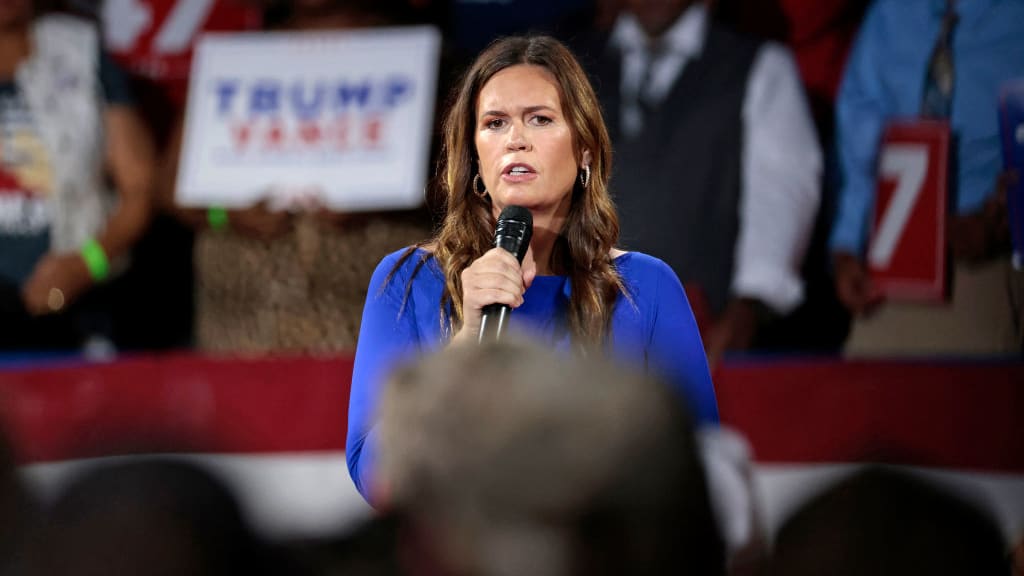 Arkansas Governor Sarah Huckabee Sanders moderates a town hall meeting with former US President and Republican presidential candidate Donald Trump at the Dort Financial Center in Flint, Michigan, on September 17, 2024.