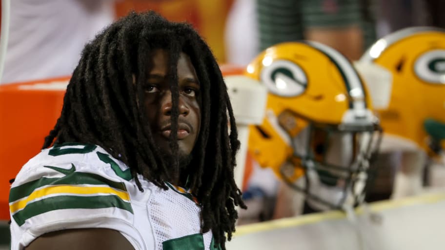 Jonathan Garvin sits on the bench during an NFL preseason game in 2022.