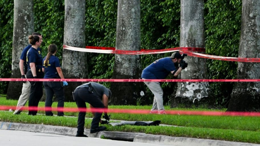 Members of FBI are seen at the crime scene outside the Trump International Golf Club in West Palm Beach, Florida, on Sunday.