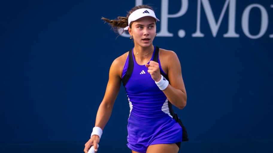 Iva Jovic celebrates after winning a point in a match.