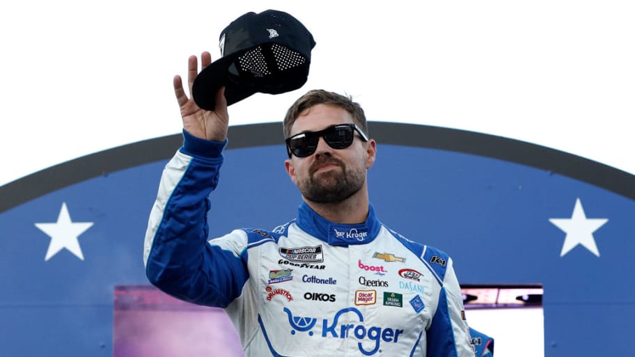 Ricky Stenhouse Jr., driver of the #47 Kroger Health/Icy Hot Chevrolet, waves to fans as he walks onstage during driver intros prior to the NASCAR Cup Series All-Star Race at North Wilkesboro Speedway.