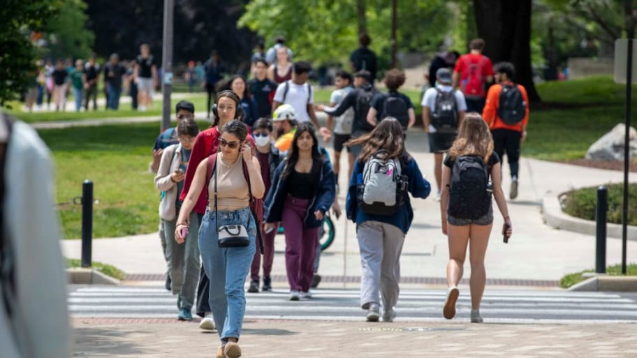Students walk around campus at the University of Maryland in College Park.