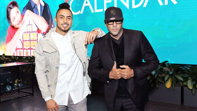 Quincy Brown, left, and Al B. Sure!, right, pose together on stage.