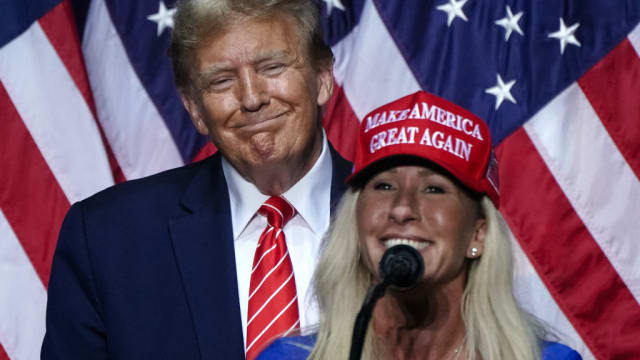 Rep. Marjorie Taylor Greene (R-GA) speaks alongside former US President and 2024 presidential hopeful Donald Trump at a campaign event in Rome, Georgia.