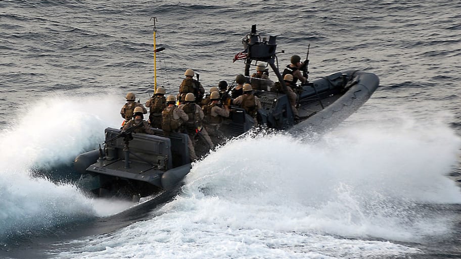 U.S. Marine Corps approach the Magellan Star during a boarding and seizure operation to retake the motor vehicle after it was attacked and boarded by pirates.