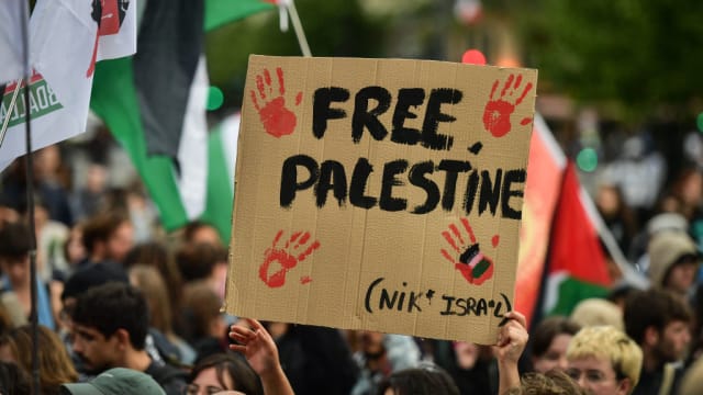 A protest sign reading “Free Palestine.”