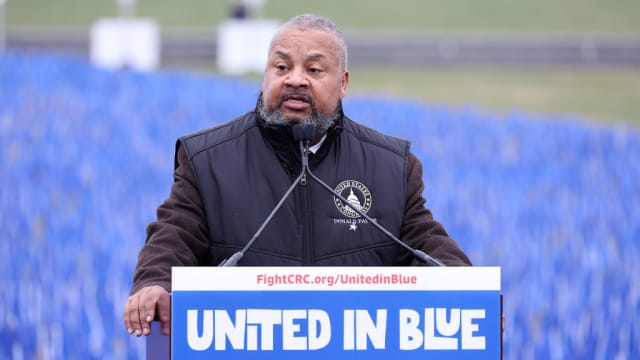 Donald Payne Jr. delivers a speech from a podium.