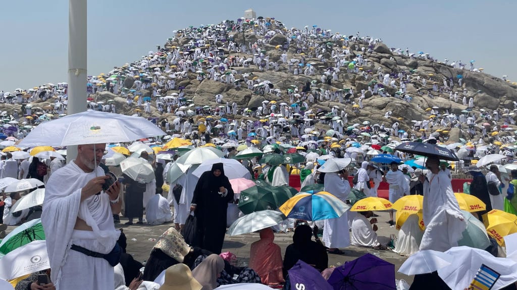 Prospective pilgrims pray at the Jabal ar-Rahmah in Arafat as Muslims continue their worship to fulfill the Hajj pilgrimage in Mecca, Saudi Arabia, on June 15, 2024. 