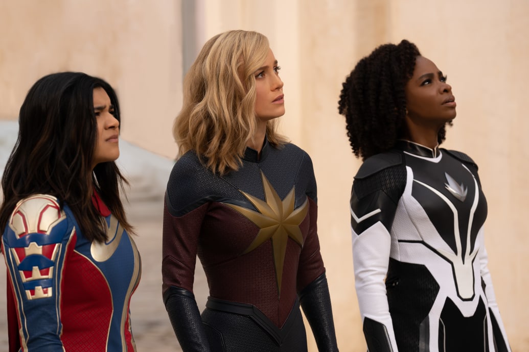 Photo still of Iman Vellani as Ms. Marvel/Kamala Khan, Brie Larson as Captain Marvel/Carol Danvers, and Teyonah Parris as Captain Monica Rambeau in The Marvels.