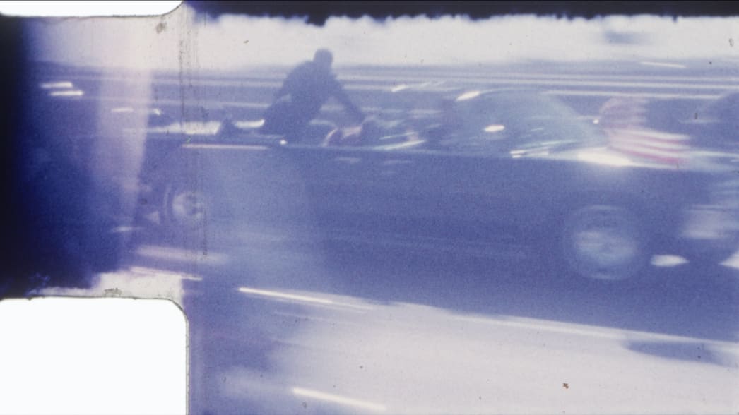 John F. Kennedy's limousine driving to Parkland Memorial Hospital.