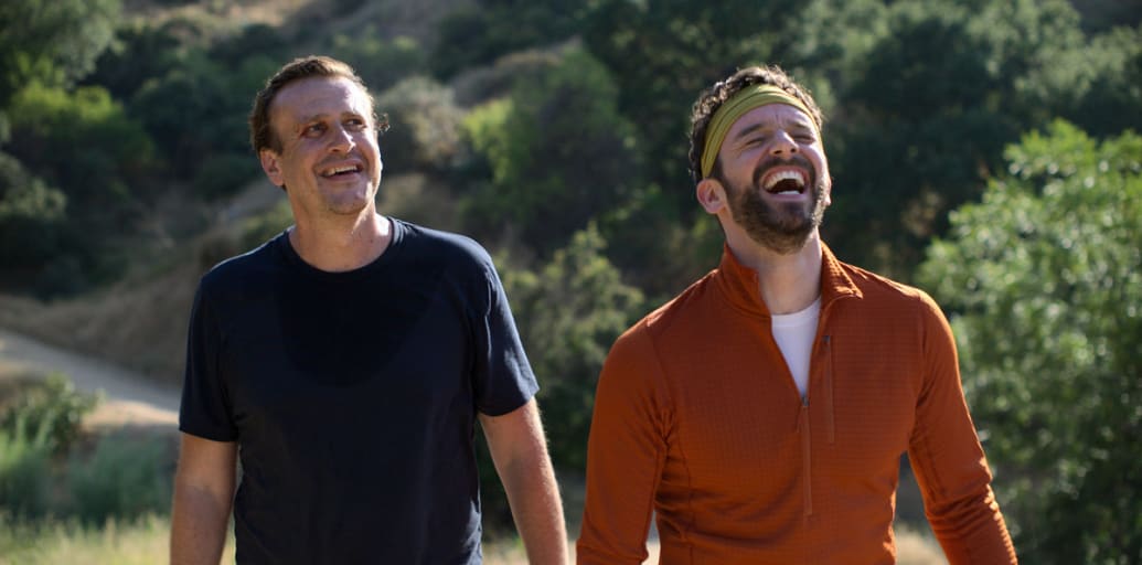 Jason Segel and Michael Urie laugh in a still from ‘Shrinking.’