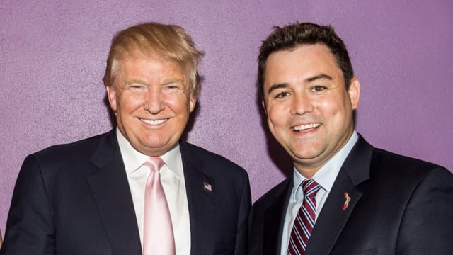 A photo of Florida GOP Chair Christian Ziegler posing with former President Donald Trump.