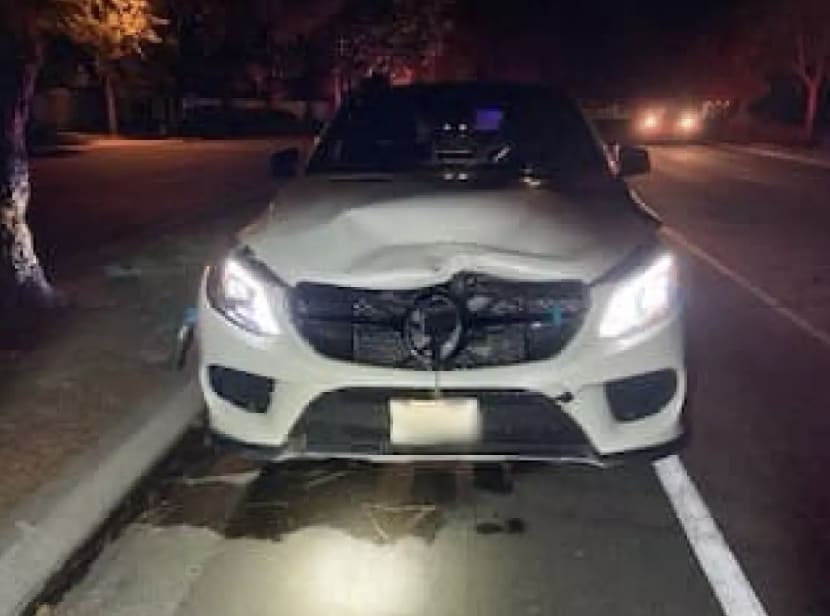 Rebecca Grossman’s white Mercedes SUV with damage to its front.