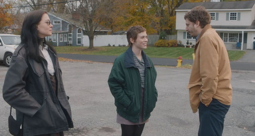 Hannah Gross, Sophia Lillis and Michael Cera stand next to each other in a still from ‘The Adults’