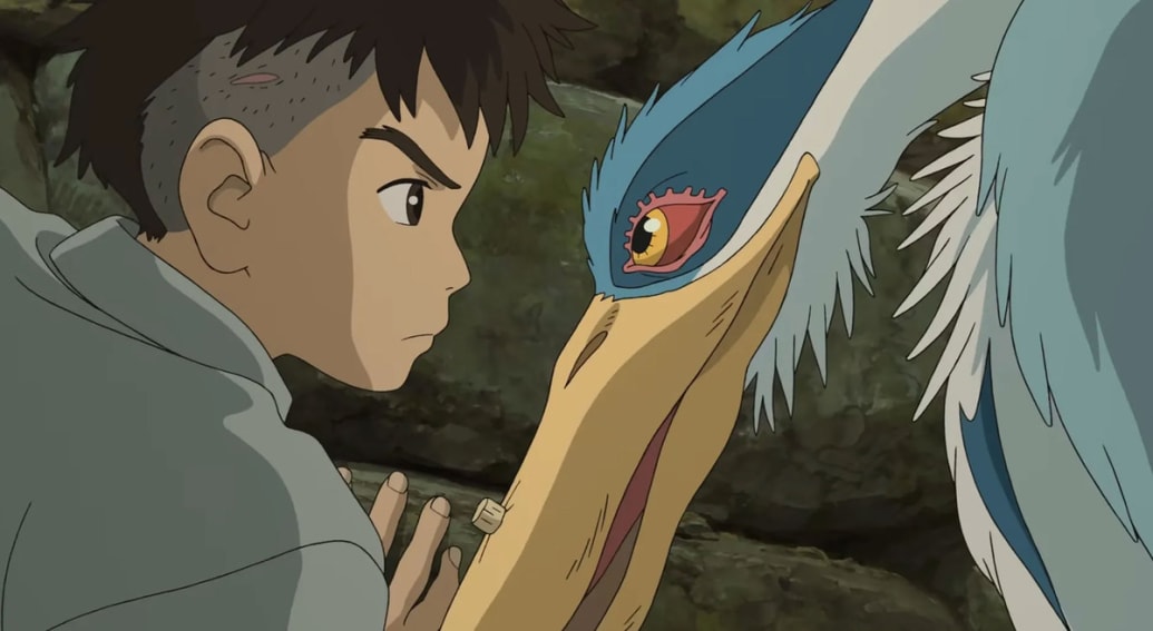 Mahito and the Grey Heron stare at each other in a still from ‘The Boy and the Heron’
