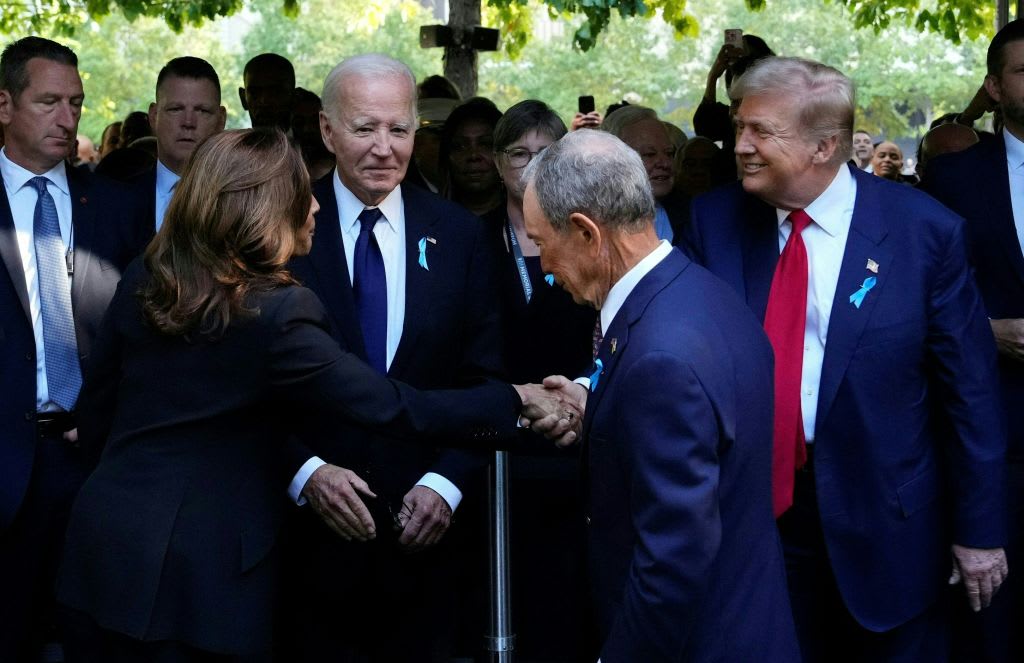 Vice President Kamala Harris shakes hands with former President Donald Trump as former Mayor of New York Michael Bloomberg and President Joe Biden look on.