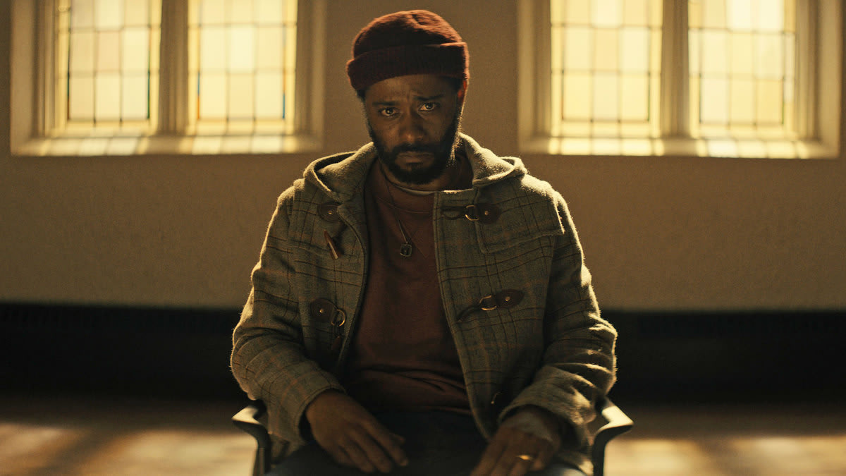 A still from ‘The Changeling’ shows LaKeith Stanfield sitting in a chair with tears in his eyes