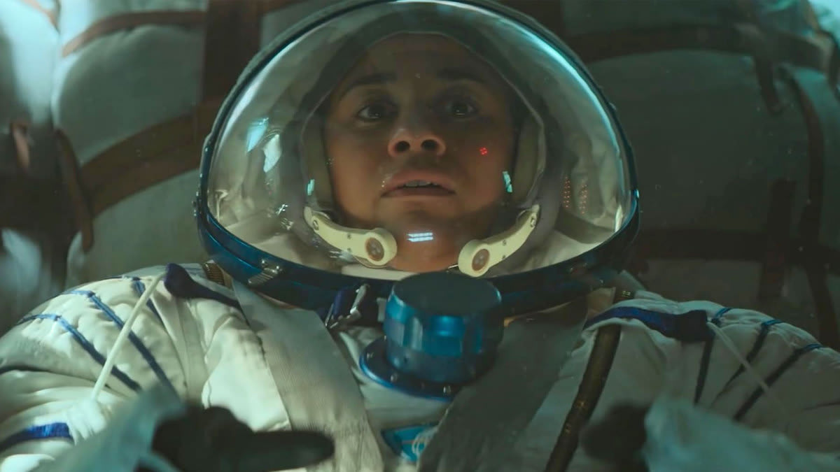 A close up of Ariana Debose as an astronaut inside of a ship