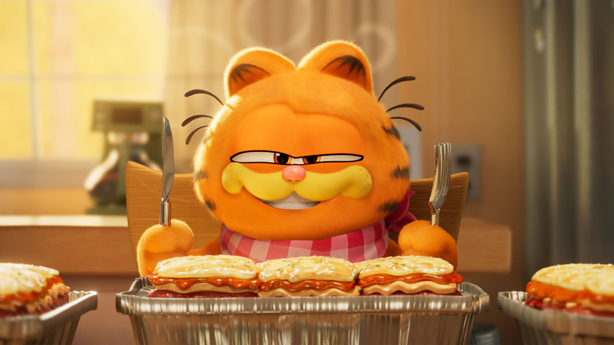 Garfield eats lasagna in a still from ‘The Garfield Movie’