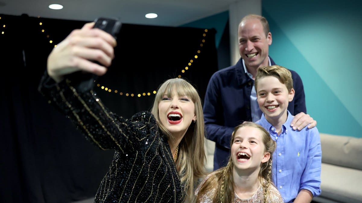 Taylor Swift takes a selfie with Prince William and his children Princess Charlotte and Prince George. 