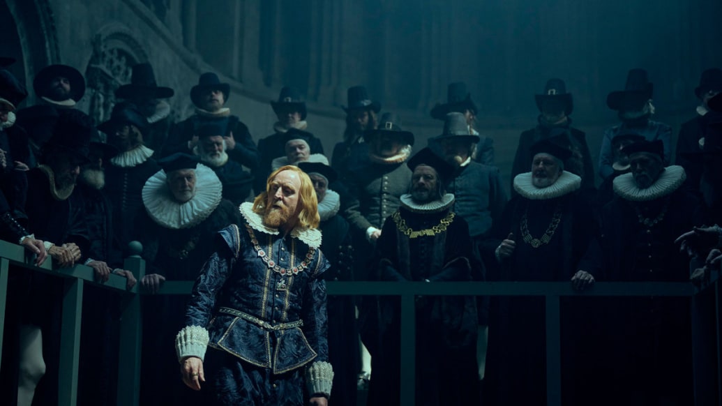 Tony Curran speaks to a crowd of people in a still from ‘George and Mary’