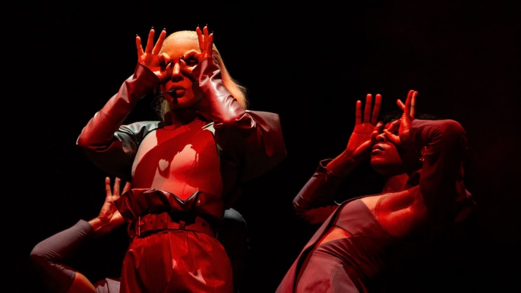 Lady Gaga puts her hands over her eyes during the Chromatica concert.