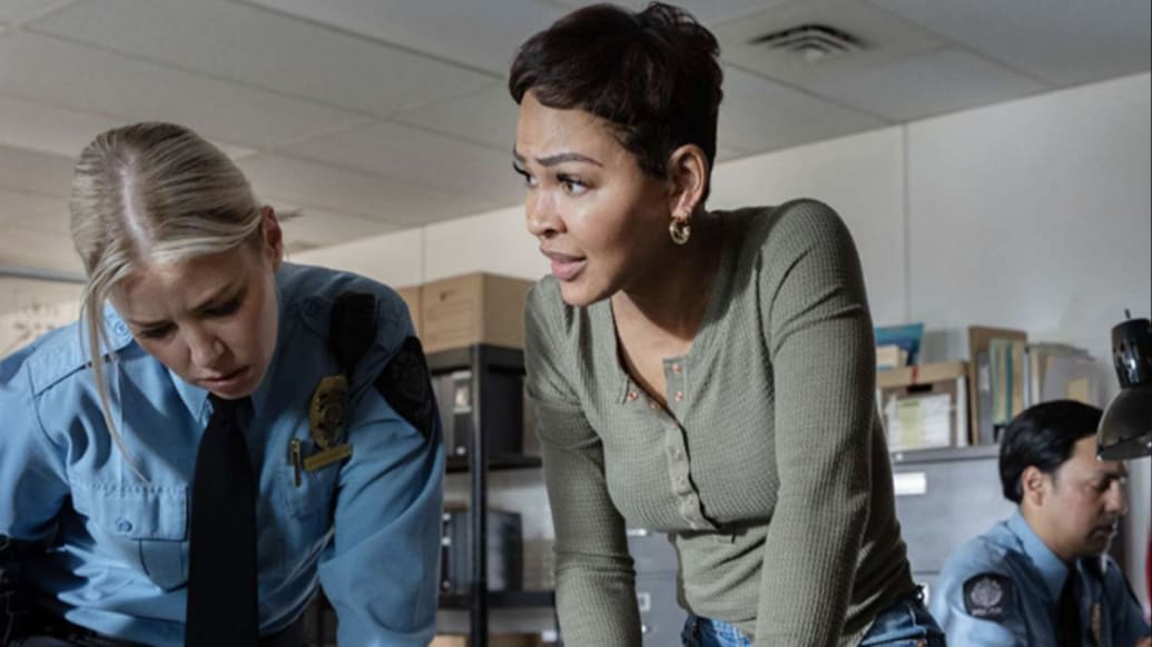 Ariana Maddix and Meagan Good in a police station in a still from ‘Buying My Daughter Back’