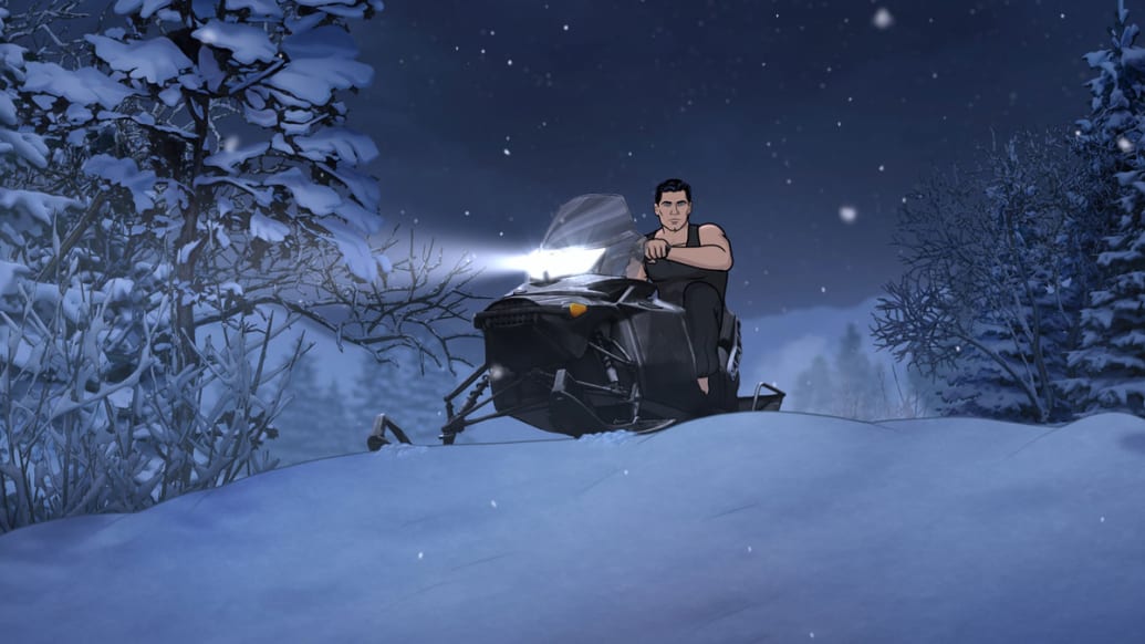 Archer sits on a snowmobile in a still from ‘Archer’