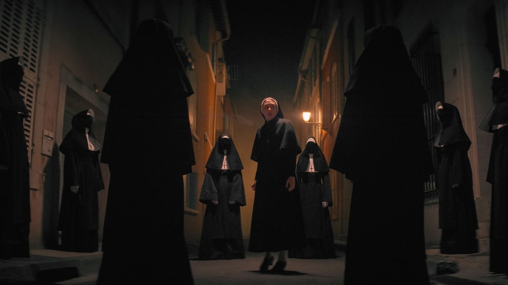 A photo including a still image from the film The Nun II