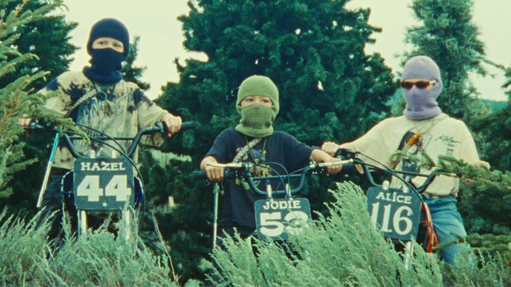 Photo still of children on dirtbikes in 'Riddle of Fire'