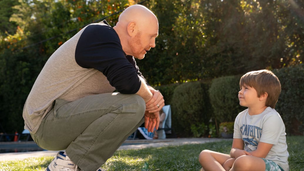 Bill Burr and his son chat outside in Old Dads.